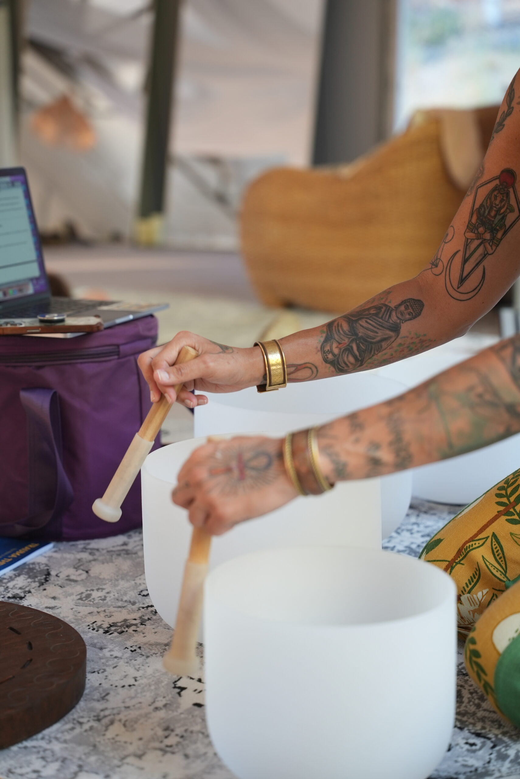 Licensed sound healing facilitator playing singing bowls at Highlands in Bloom residential mental health and autoimmune treatment center Agoura Hills California