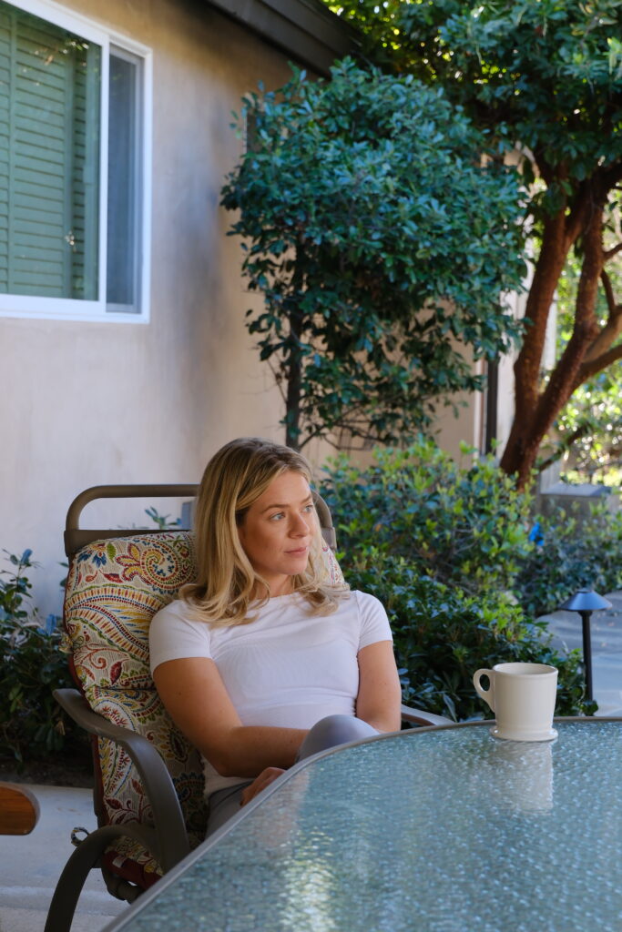 A client relaxes at a table in a peaceful, modern residential rehabilitation facility in Agoura Hills, California